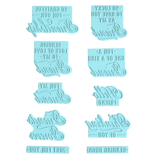 Ten light blue silicone stamps featuring a variety of positive messages, ideal for creating hot foil sentiments or using alongside the Gilded Friendship Sentiment Foil Plates on handmade cards, arranged in two vertical columns on a white background; text appears reversed for stamping purposes.