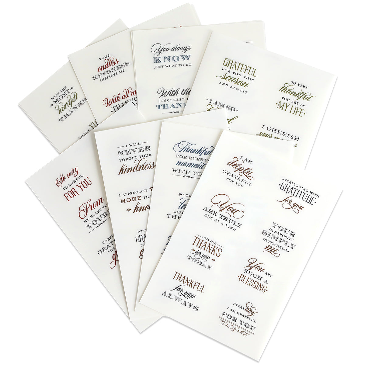 Ten sheets of With Gratitude Sentiment Rub Ons showcase a variety of gratitude and appreciation quotes, ideal for papercrafting embellishments or thank you card sentiments. Each sheet presents assorted fonts and colors, with the rub on designs displayed in a fanned arrangement on a white background.