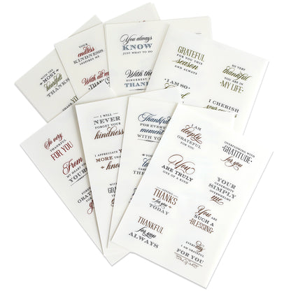 Ten sheets of With Gratitude Sentiment Rub Ons showcase a variety of gratitude and appreciation quotes, ideal for papercrafting embellishments or thank you card sentiments. Each sheet presents assorted fonts and colors, with the rub on designs displayed in a fanned arrangement on a white background.