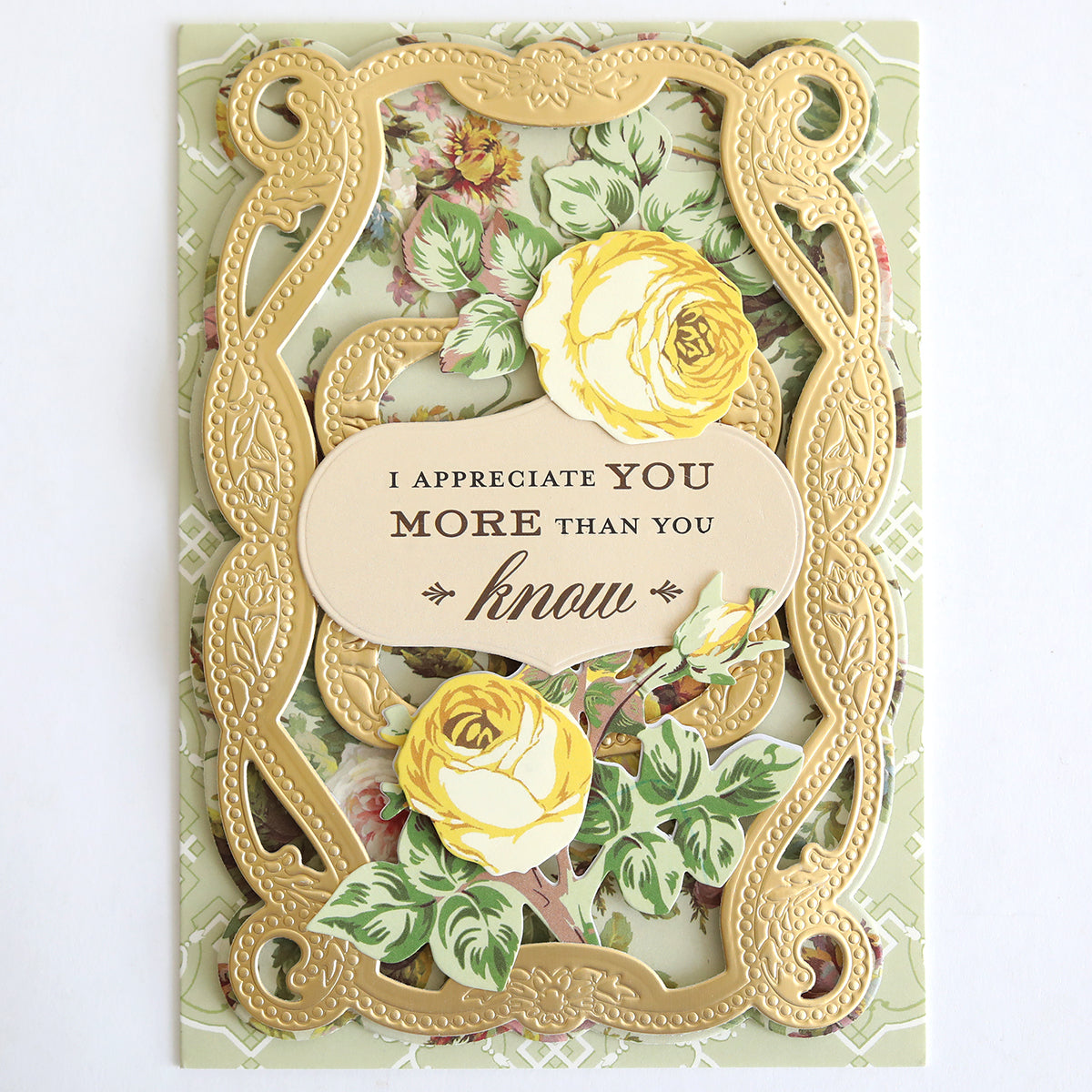Decorative card featuring an ornate gold frame, yellow roses, and the heartfelt message “I appreciate you more than you know” in the center—ideal for expressing your feelings with the With Gratitude Sentiment Rub Ons and other papercrafting supplies.