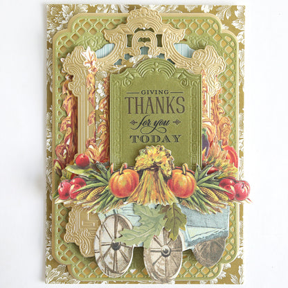 Handmade card with ornate gold borders, fruits, vegetables, and wheels, featuring the message “Giving Thanks for you Today” in the center—perfect for expressing heartfelt thank you sentiments. Finished using premium papercrafting supplies and delicate With Gratitude Sentiment Rub Ons.