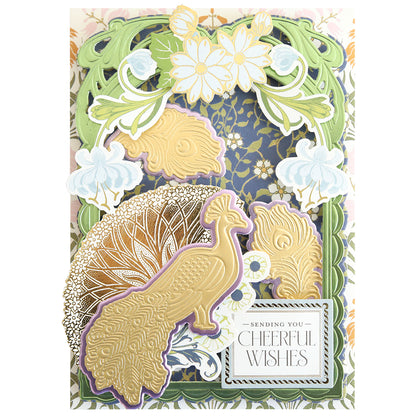 A decorative card created using Peacock Scene 3D Dies features a gold peacock, elegant floral designs, and the text “Sending You Cheerful Wishes” showcased on a richly layered, ornate background for added depth and dimension.