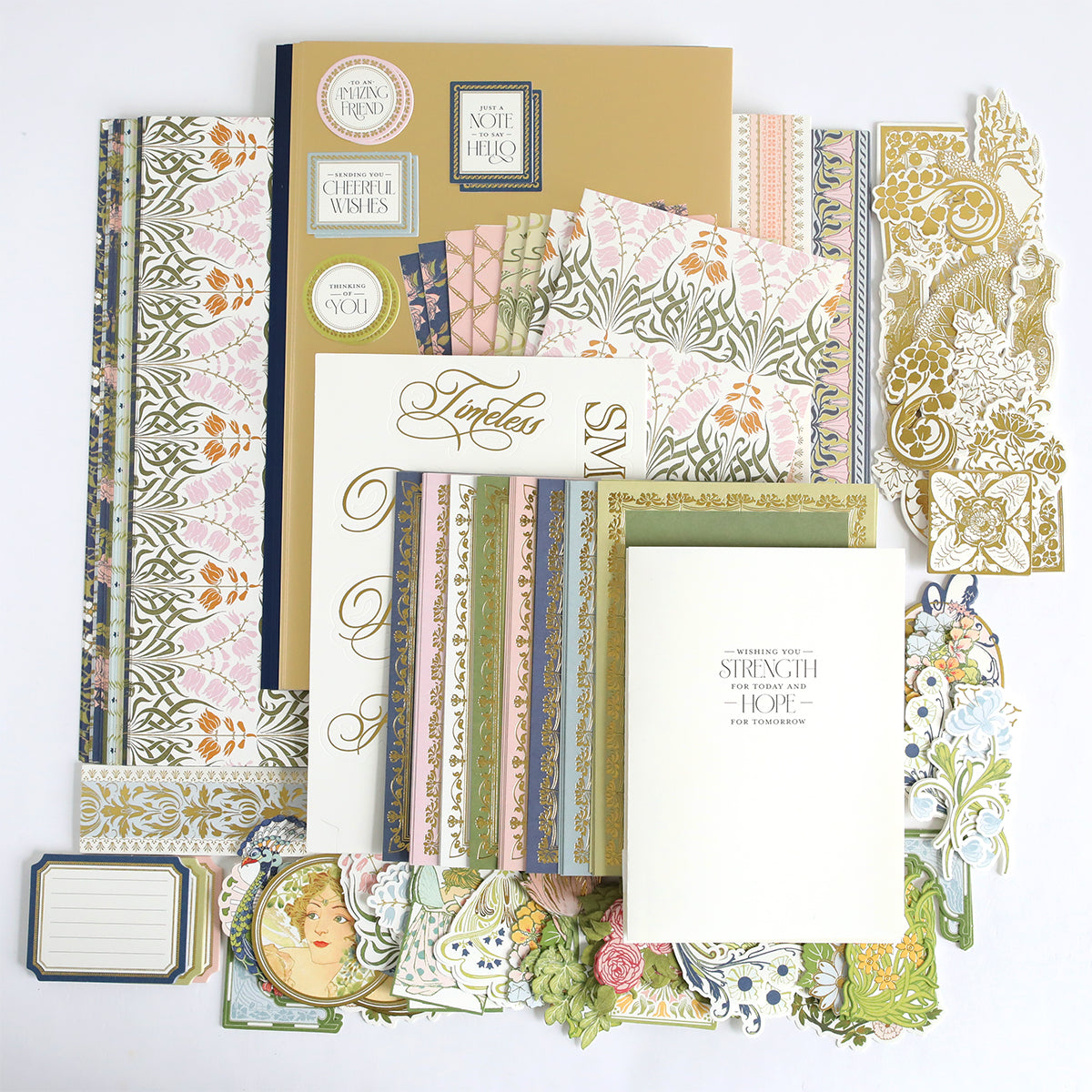 The Dahlia Ultimate Papercrafting Collection features an array of decorative stationery, patterned papers, die-cut shapes, tags, and cards with stunning floral and vintage designs—all beautifully arranged on a white background. Perfect for elevating your next papercrafting kit or creating gorgeous scrapbook pages and handmade cards.