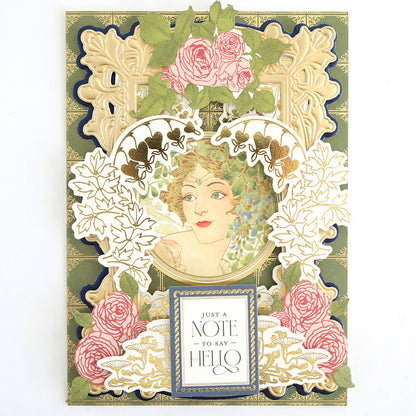 Greeting card with ornate floral designs, a vintage illustration of a woman in the center, and the message “Just a note to say hello” at the bottom—a charming addition to any papercrafting kit or collection of handmade cards.