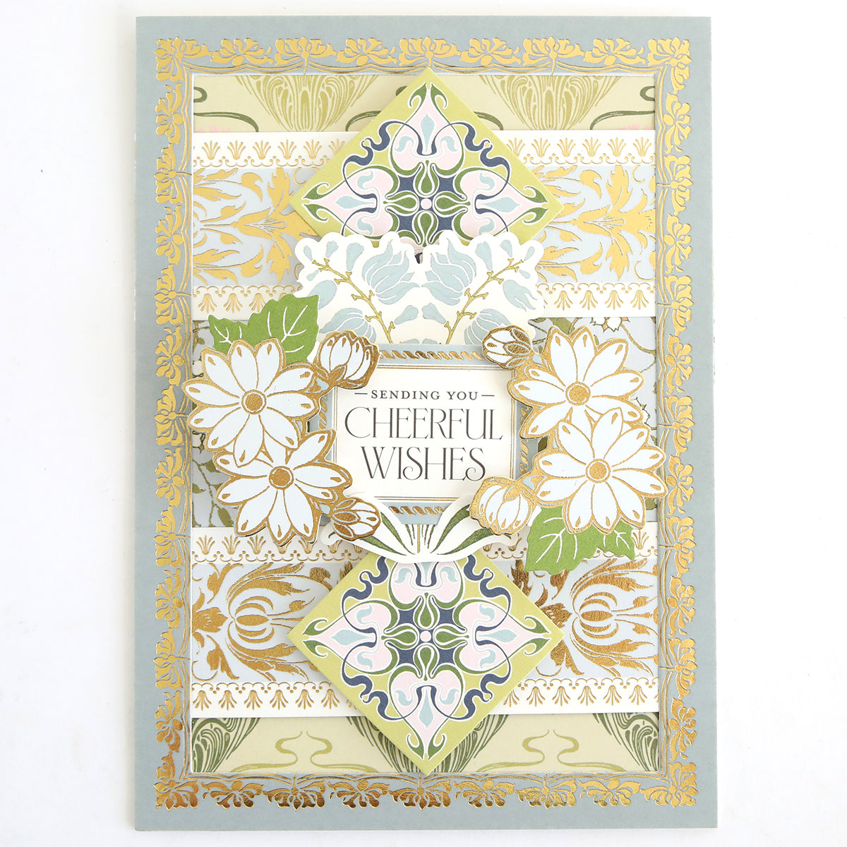 Infuse inspiration into your handmade cards or scrapbook pages with the Dahlia Ultimate Papercrafting Collection—featuring ornate gold and pastel floral designs, delicate white daisies, and the heartfelt message “Sending You Cheerful Wishes” at the center.