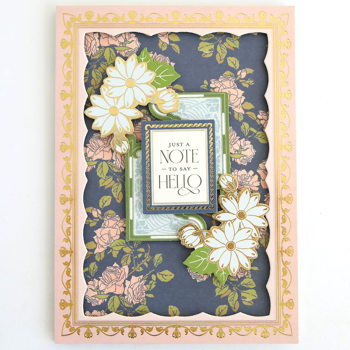 Part of the Dahlia Ultimate Papercrafting Collection, this greeting card features a floral and gold border design with elegant dahlias and roses—perfect for handmade cards or enhancing your papercrafting kit. The central message reads, “Just a note to say hello.”.