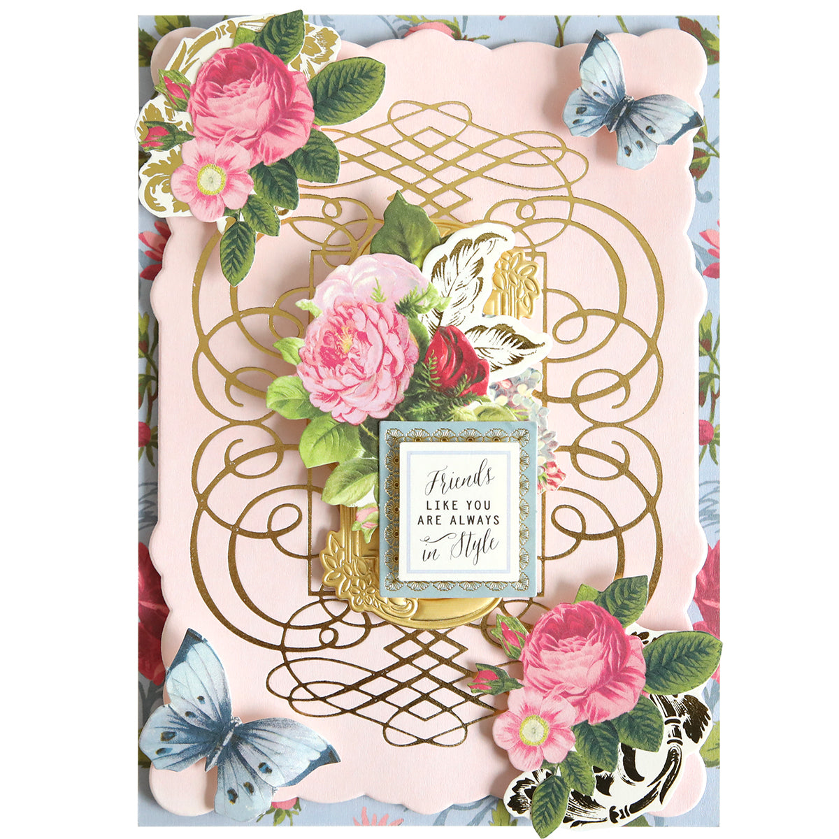 Greeting card featuring designs created with the Calligraphy Frame Gilded Hot Foil Plate, adorned with gold foil accents, pink roses, and blue butterflies. Inspired by elegant scrapbook pages, the center showcases a delicate frame bearing the sentiment, “Friends like you are always in style.”.