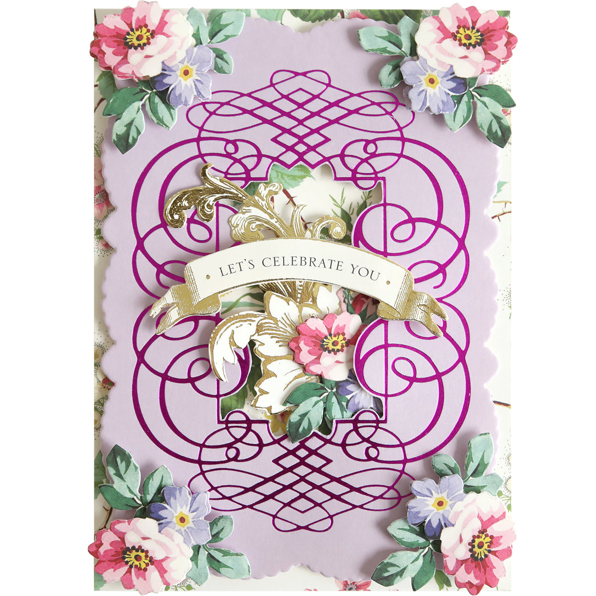 Add a sophisticated touch to your handmade cards or scrapbook pages with the Calligraphy Frame Gilded Hot Foil Plate, featuring pink and white flowers, ornate purple scrollwork, and a gold banner reading “LET’S CELEBRATE YOU!” on a lavender background.