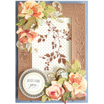 Handmade greeting card featuring the Flourish and Vine Gilded Hot Foil Plates, with an embossed brown border, floral decorations, gold foil accents, and a circular label reading “Just for you.” Ideal for paper crafting enthusiasts, the central panel showcases a brown leafy branch pattern on a dotted background.