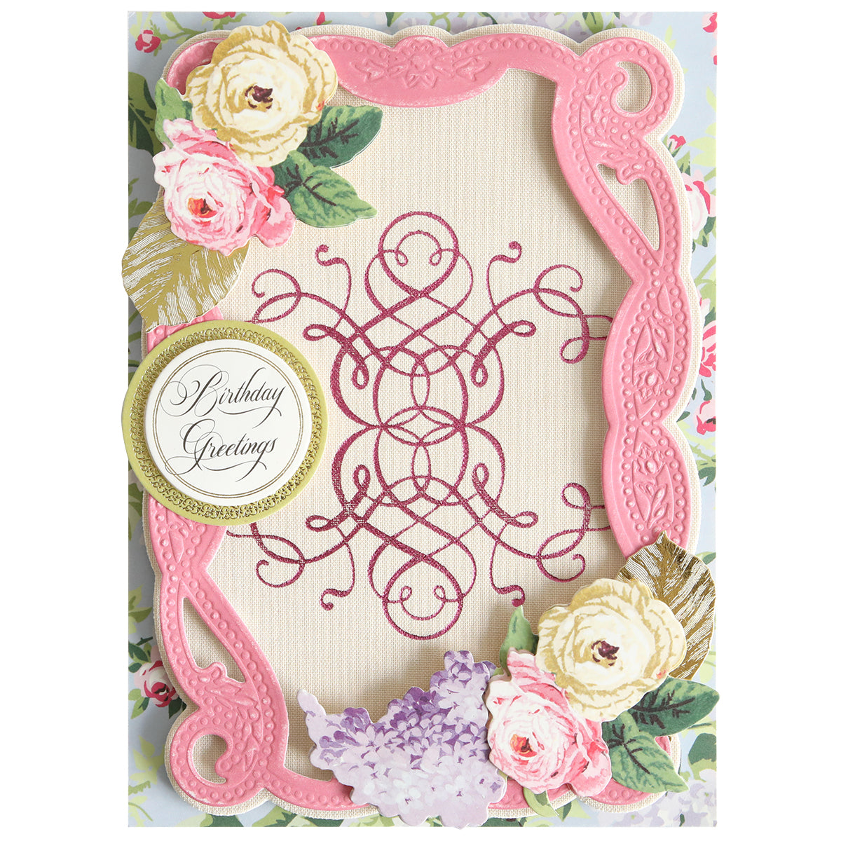 A decorative birthday card with a pink ornate frame, floral designs, and a gold-bordered circle reading “Birthday Greetings” on a patterned background—perfect for adding elegance to your paper crafting projects. The look is reminiscent of Flourish and Vine Gilded Hot Foil Plates, giving the card an exquisite, richly detailed finish.