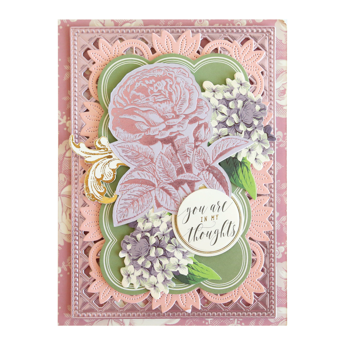 Crafted with the Rose and Pineapple Gilded Hot Foil Plates, this decorative card is perfect for papercrafting projects. It features layered floral designs in pink, purple, and green, showcasing a large rose at the center along with the sentiment “You are in my thoughts” elegantly scripted.