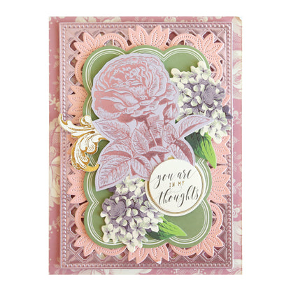 Crafted with the Rose and Pineapple Gilded Hot Foil Plates, this decorative card is perfect for papercrafting projects. It features layered floral designs in pink, purple, and green, showcasing a large rose at the center along with the sentiment “You are in my thoughts” elegantly scripted.