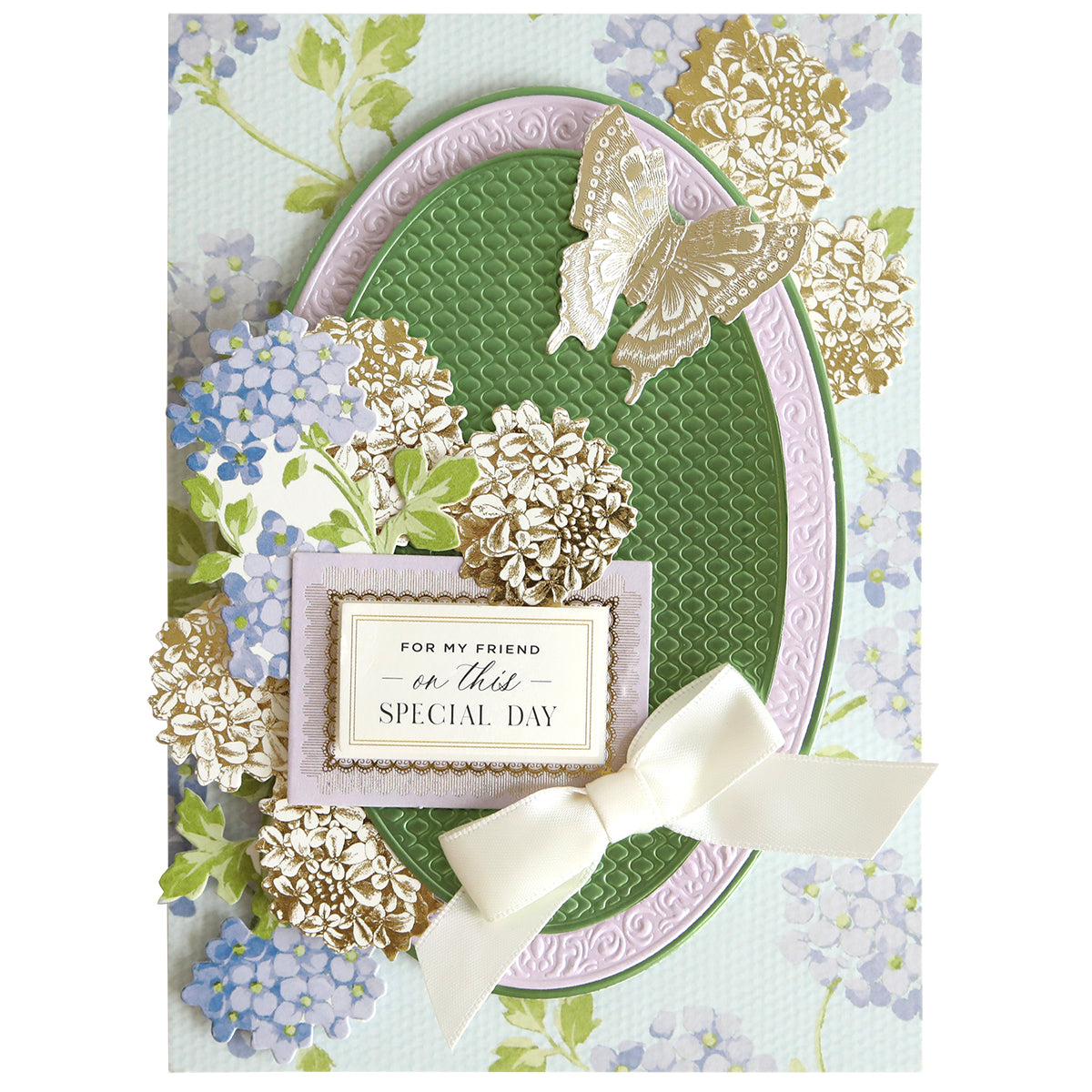 Greeting card adorned with floral and butterfly designs, highlighted by a white bow and a label that reads “For my friend on this special day,” set against a textured green and lavender background. The elegant embossed detail is expertly crafted using the Oval Pattern 3D Layer Dies, making this card ideal for card making enthusiasts and beautifully framing the heartfelt sentiment.