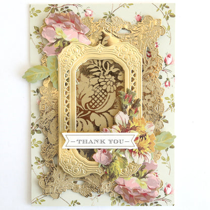 Create elegant thank you cards using the Gilded Solid Foil Plate 4x6, featuring gold embossed frames and layered paper flowers—ideal for hot foil or metallic backgrounds with a floral patterned banner reading “Thank You.”.