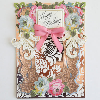 Create an elegant birthday card using the Gilded Solid Foil Plate 4x6 for gold accents, floral embellishments, and a pink ribbon with a “Happy Birthday” greeting centered on white cardstock—ideal for stylish card making.