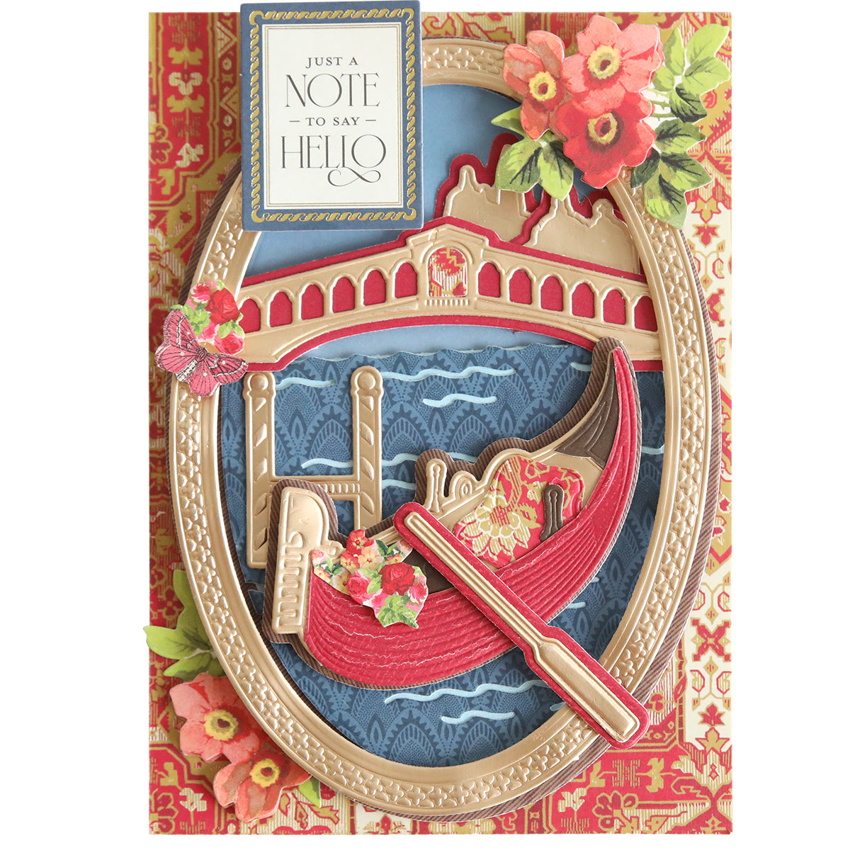 Greeting card featuring a red gondola on blue water, created with the Gondola 3D Scene Dies to add beautifully dimensional die cuts, all framed by a gold decorative oval, flowers, and a “Just a note to say hello” sign against a patterned background—perfect for Venice-themed paper crafting projects.