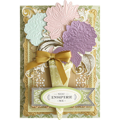 Featuring the Dahlia, Mum, and Sunflower 3D Floral Dies, this greeting card showcases exquisite embossed blooms, delicate gold accents, a cheerful yellow ribbon, and a decorative “You inspire me” label on a patterned background—perfect for paper craft enthusiasts who appreciate intricate botanical detail.