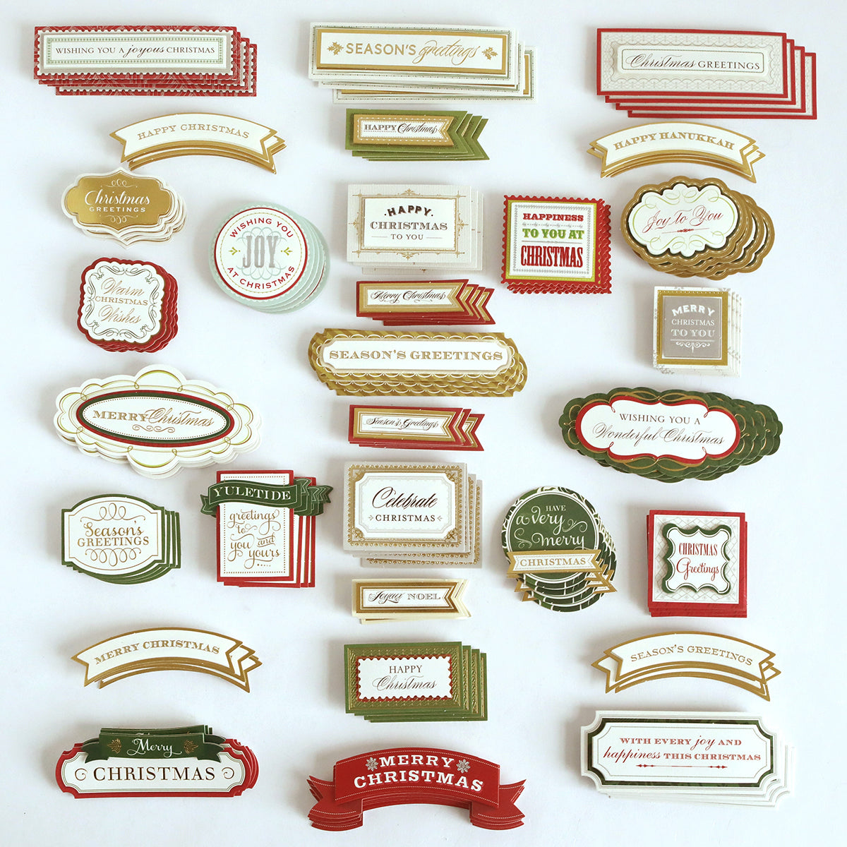A set of Favorite Christmas Sentiment Stickers featuring festive holiday greetings in red, green, gold, and white, all neatly arranged on a white background.