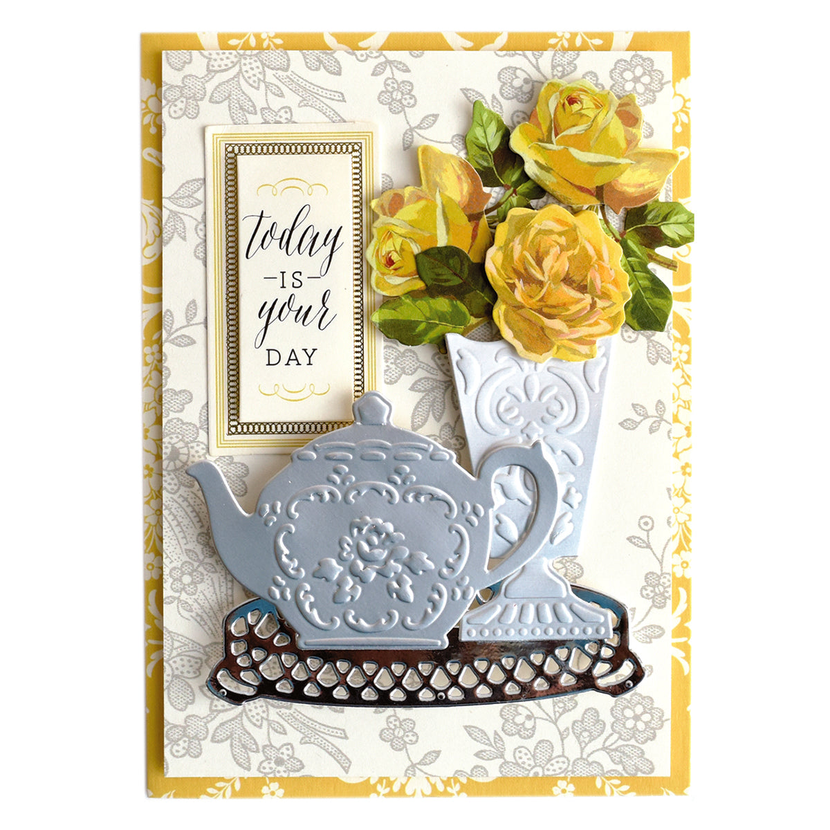 Greeting card featuring a blue teapot, a white vase with yellow roses, and the message “Today is your day” on a yellow and floral background, beautifully accented with Tea Party Cut and Emboss Dies for an elegant touch of tea-inspired craft embellishments.