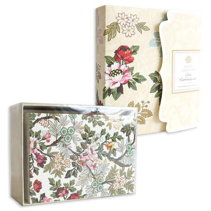 Lian Embellishments and Cards: A box set of handmade cards with matching envelopes, featuring a cream background, vibrant floral patterns, and decorative embellishments.
