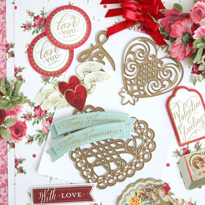 The Anna Griffin® 2026 Papercrafting Mystery Box Subscription features Valentine’s Day and anniversary-themed paper crafts, metallic die cuts, floral motifs, and greetings—perfect for card making lovers.
