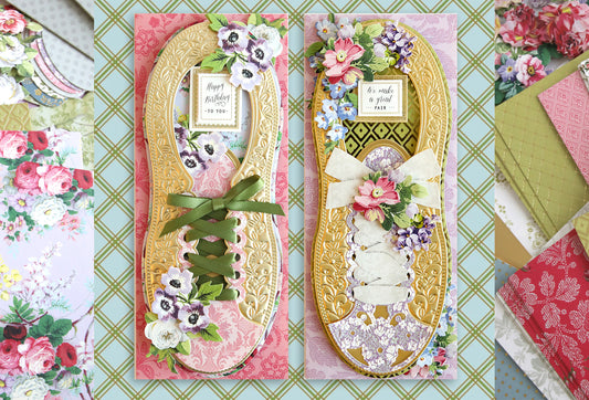 Two handmade flip-flop-shaped greeting cards adorned with floral patterns and decorative elements on a colorful, patterned background.
