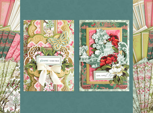 Two ornate greeting cards with floral patterns and decorative elements, surrounded by matching patterned papers on a teal background.