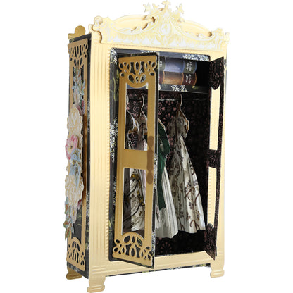 An Anna Griffin antique armoire with a gold and black dresser filled with a dress and Anna Griffin crafting projects.