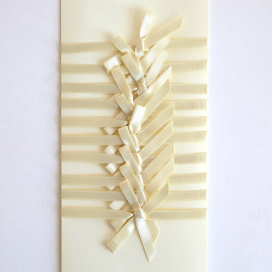 The Ivory Satin Bows 10 count set features cream-colored handmade cards adorned with double-faced satin bows woven in a crisscross pattern, adding a beautifully textured design.