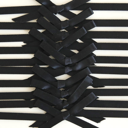 Close-up of Black Satin Bows 10 count, arranged in a crisscross pattern with black ribbons on a white background—perfect for handmade cards.