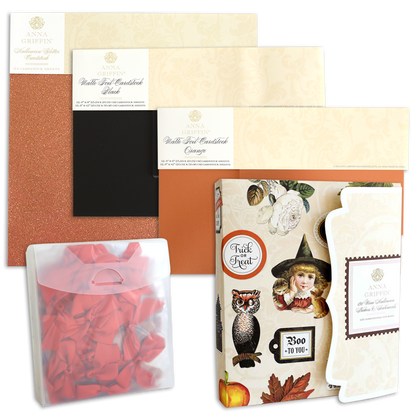 Four packs of Anna Griffin glitter cardstock sheets in assorted colors and textures, a transparent pouch with red ribbons, and a Halloween-themed greeting card kit with festive stickers are all included in the Haunted Halloween Haul—perfect for your spooky crafting adventures.