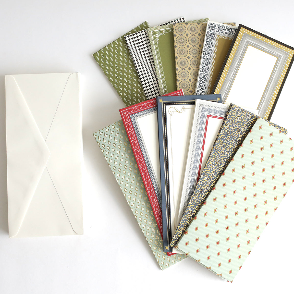 A collection of Beaux Regards Slimline Cards and Envelopes on a white surface.