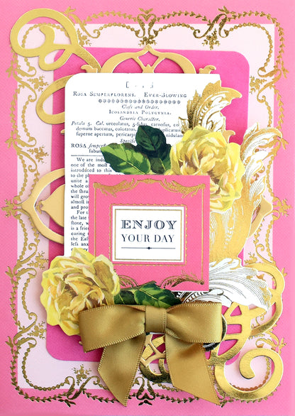Showcase your special moments with the Birthday Collage Card Toppers—a decorative card featuring gold embellishments, yellow roses, a gold ribbon bow, and the message “ENJOY YOUR DAY” on a pink background. Perfect for adding vintage collage accents or elevating your handmade creations.