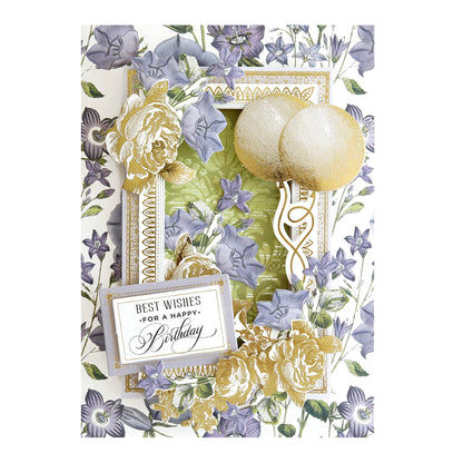 A Birthday Greetings Card Making Kit featuring purple flowers, golden decorations, and a white card with the text "Best Wishes for a Happy Birthday.