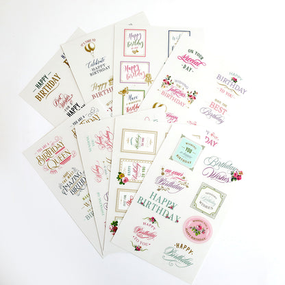 An array of assorted birthday cards featuring various designs, Birthday Sentiment Rub Ons, and typography styles displayed on a white background.