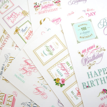Assorted birthday cards with floral designs and **Birthday Sentiment Rub Ons** displayed on a white background.