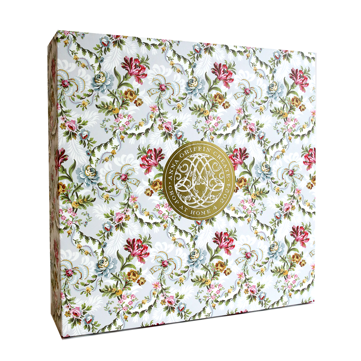 A white and pink floral wedding card adorned with a gold medallion crafted using Anna Griffin's Create Crop At Home 4.