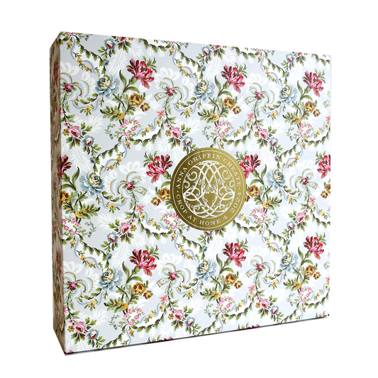 A white and pink floral wedding card adorned with a gold medallion crafted using Anna Griffin's Create Crop At Home 4.