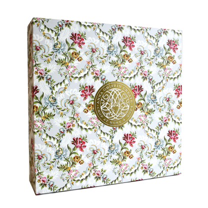 The Crop at Home 4 Scrapbook Collection includes a decorative box crafted from premium cardstock, adorned with a floral pattern and highlighted by a gold circular emblem at the center.