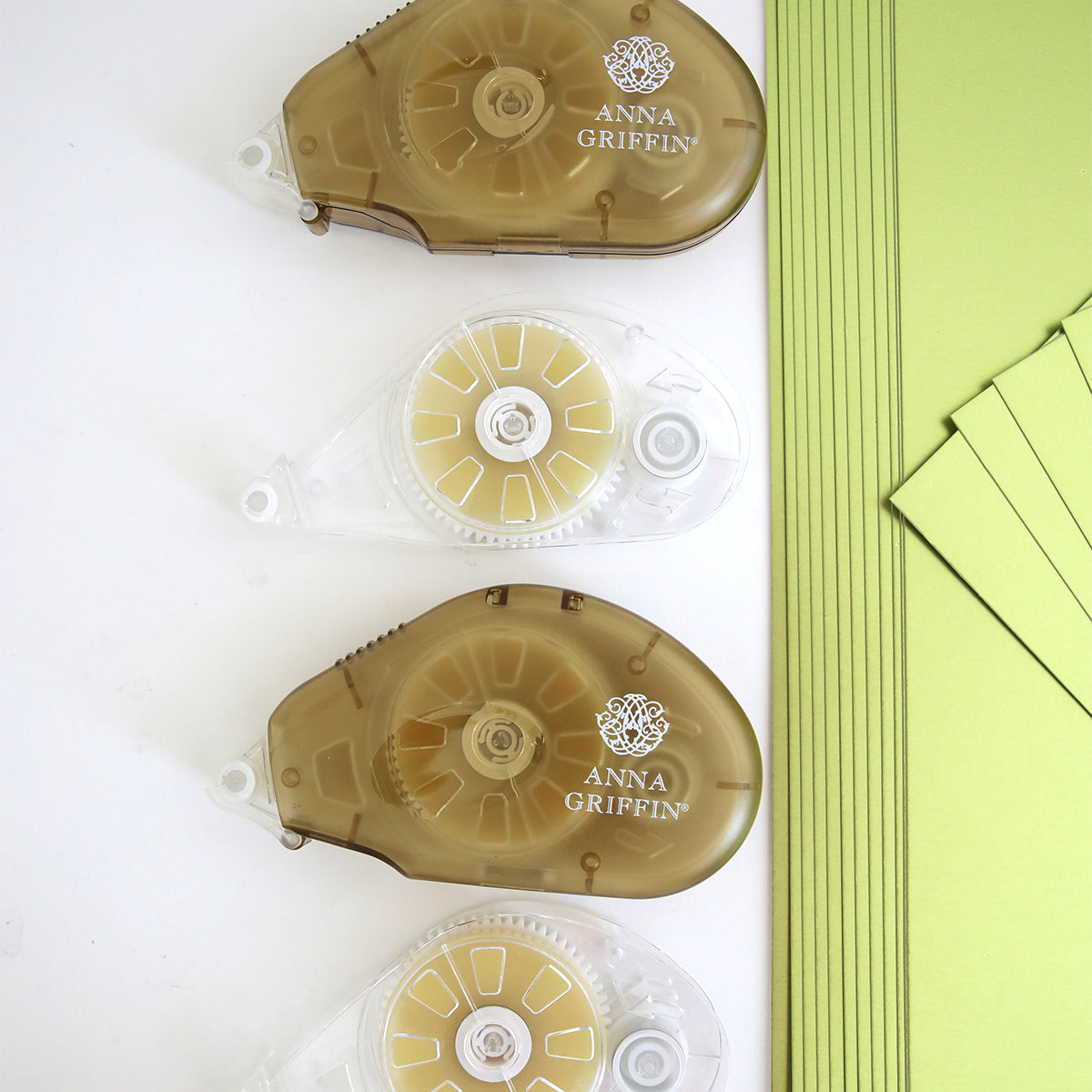 The Create Supply Box includes two brown and one clear "Anna Griffin" tape runners, stacked green Matte Foil Cardstock sheets, and matching green cards—essential supplies for your crafting projects.