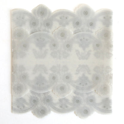 The Silver Vellum Gatefold Wrap 10 pack features translucent, scalloped-edged paper with a symmetrical decorative pattern and dotted details, ideal for creating elegant wedding invitation or lace vellum wraps.