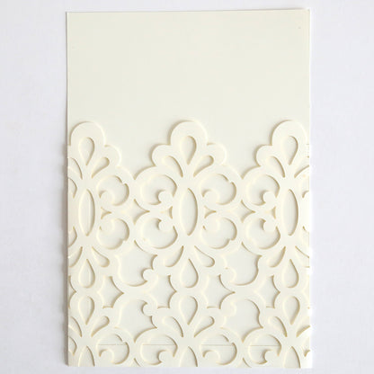 The Ivory Medallion Diecut Pocket 10 pack features ivory cards with ornate, symmetrical laser-cut patterns on the lower half, resembling elegant invitation pockets, displayed against a plain white background.