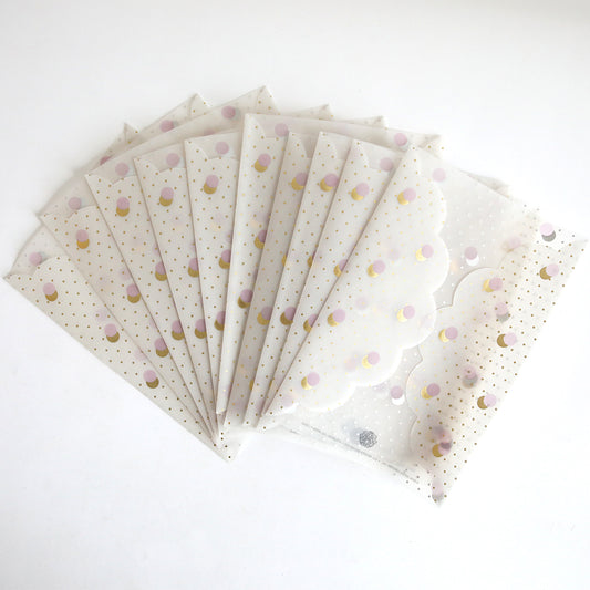 The Lavender & Gold Dots Vellum Gatefold 10 pack features translucent scalloped-edge envelopes with gold polka dots, perfect for wedding invitations and beautifully displayed in a fanned-out arrangement on a white background.