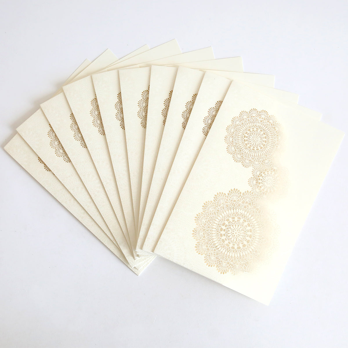 A pack of 10 Ivory Laser Cut Lace Pockets, perfect for pairing with elegant wedding invitations or custom invitation cards, displayed in a fanned-out arrangement on a white background.