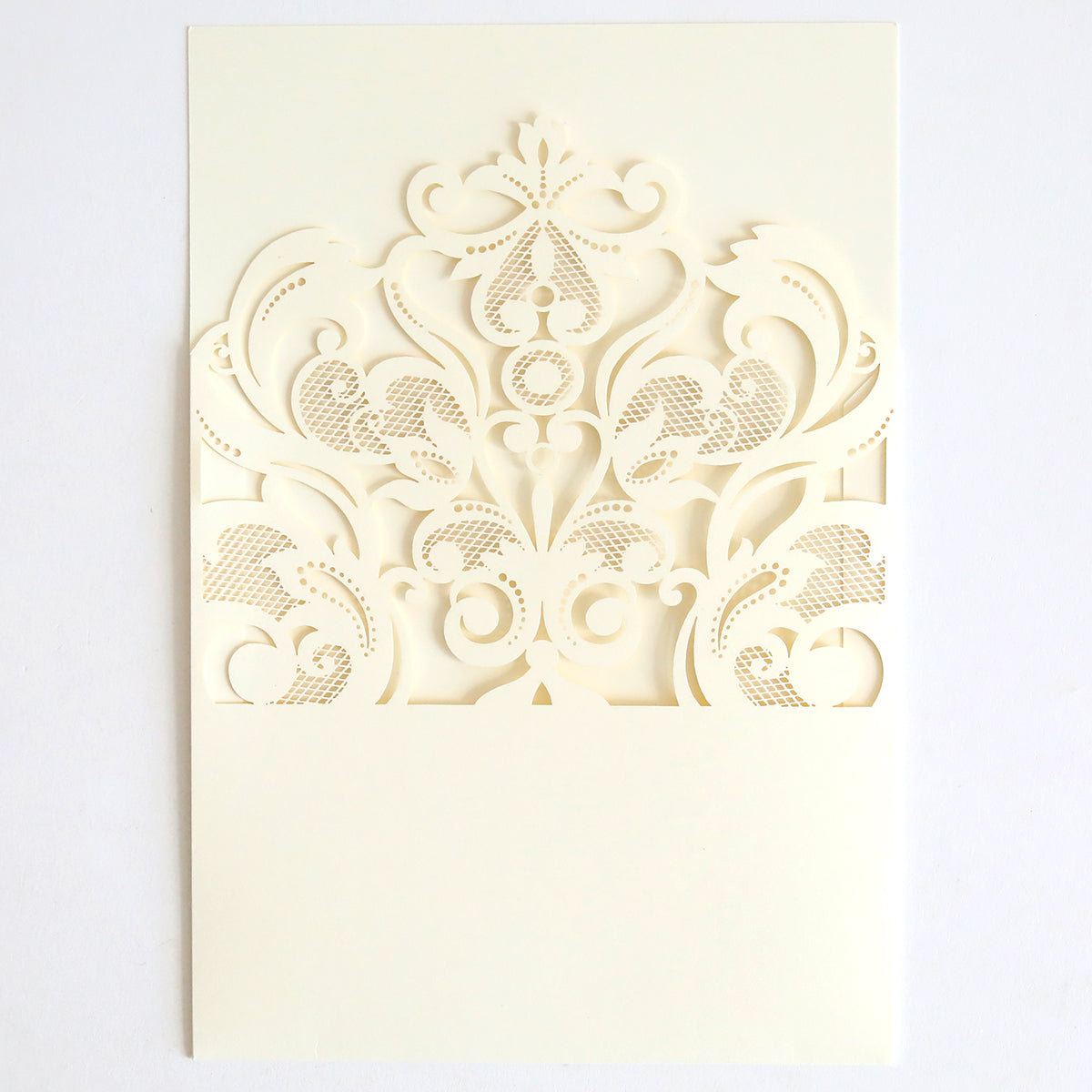 The Ivory Laser Cut Pocket 10 pack features off-white cards with ornate ivory lace laser-cut pockets and scrollwork on the upper half—an elegant choice for decorative wedding invitations.