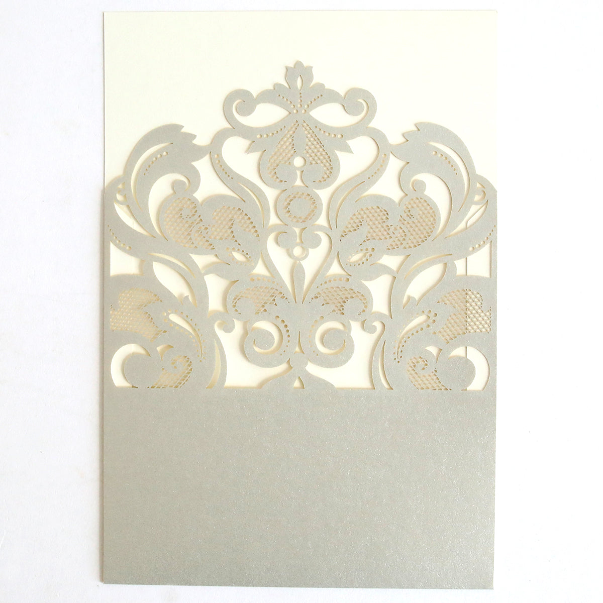 The Silver Laser Cut Pocket 10 pack features ornate, floral, and scroll designs on a cream background—ideal DIY wedding invitation supplies for an elegant touch.