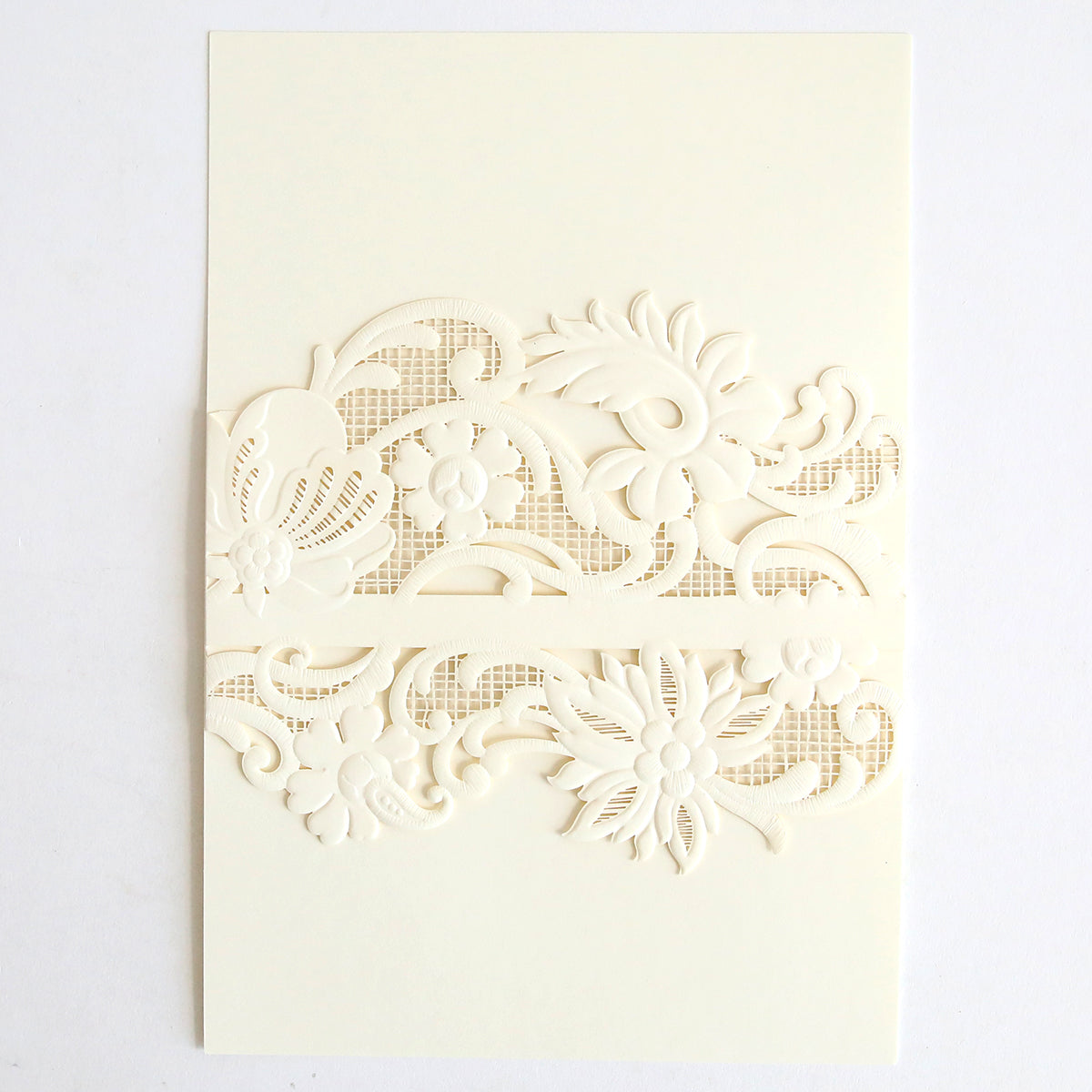 The Ivory Laser Cut Lace Belly Band 10 pack features cream-colored invitations with intricate floral and butterfly cutouts on the front, revealing a textured mesh pattern beneath, elegantly complemented by ivory lace belly bands.