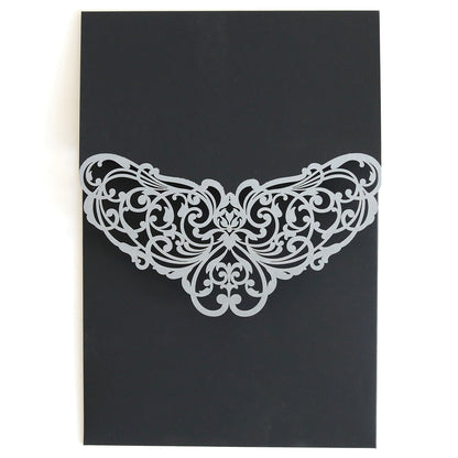 The Black Laser Foil Flap Pocket 10 pack features a black pocket invitation with an ornate silver laser-cut filigree design at the top center—ideal for creating custom wedding invitations.