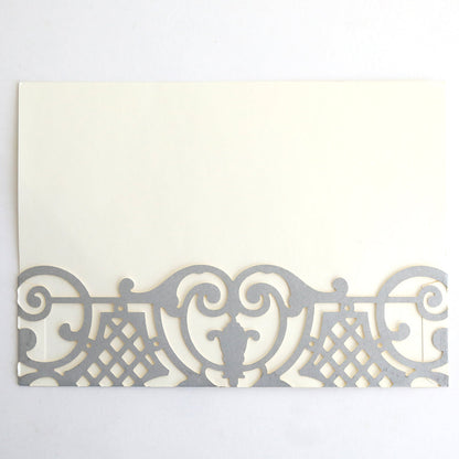 The Silver Diecut Pocket 10 pack features rectangular cream-colored cards with an ornate silver border along the bottom—ideal for elegant wedding or custom invitations with sophisticated style.