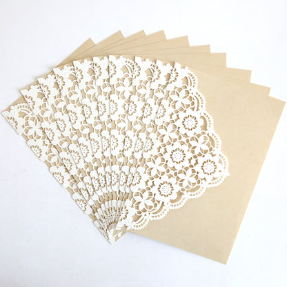 The Lace Laser Cut Invitation 10 pack features beige envelopes with white, lace-patterned overlays—ideal for elegant wedding invitation wraps or sophisticated lace lasercut invitations.